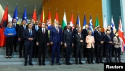 Germany's Chancellor Olaf Scholz, European Commission President Ursula von der Leyen and other attendees pose for a family photo at the Western Balkans Summit at the Chancellery in Berlin on November 3.
