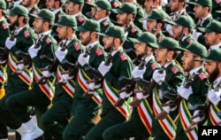 Members of Iran's Islamic Revolutionary Guards Corps march in an annual military parade in Tehran.