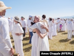 White Brotherhood followers embrace after the paneurhythmy.