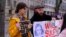 Demonstrators rally in support of Seda Suleimanova in Berlin on February 27.