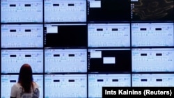  A woman looks at screens during a NATO cyberdefense exercise in Estonia in 2019. 
