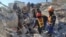 Rescuers search the rubble for survivors following a February 9 earthquake in Turkey.