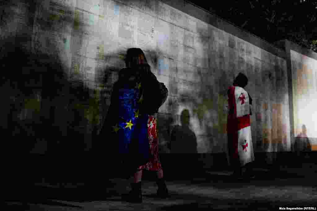 Protesters stop to view the names of fallen soldiers who battled against the Soviet Army in the 1920s, the Abkhaz war in 1992-93, and in the August 2008 Russo-Georgian War at Heroes' Square. One of the organizers told RFE/RL that a large&nbsp;protest against the "foreign agent" bill is currently being planned for May 11.