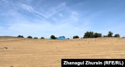 From a distance, only the roofs of the villagers' homes in Zhyltyr can be seen.