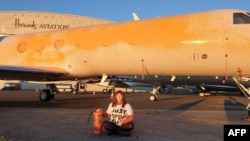 Unul din noile cuvinte germane oficial acceptate este „Klimakleber” (explicat mai jos). 