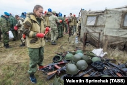 A 2017 file photo of a woman in Russian-controlled Donetsk undergoing qualification testing.