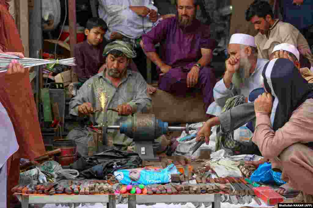 An Afghan blacksmith sharpens knives to be used for sacrificing animals in the eastern city of Jalalabad. During the festival -- one of the most important in the the Muslim calendar -- animals are sacrificed after worshippers attend Eid prayers to commemorate the willingness of Prophet Ibrahim (Abraham) to sacrifice his son as an act of supplication to God.&nbsp;