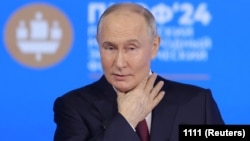 Russian President Vladimir Putin demanded a commitment from Ukraine to abandon plans to join NATO. (file photo)