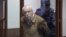 Researcher Anatoly Maslov enters a St. Petersburg court shortly before his conviction on a treason charge he denies on May 21.