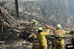 На згарищі концертної зали «Крокус Сіті Хол» на околиці Москви після теракту. Світлину зроблено 23 березня