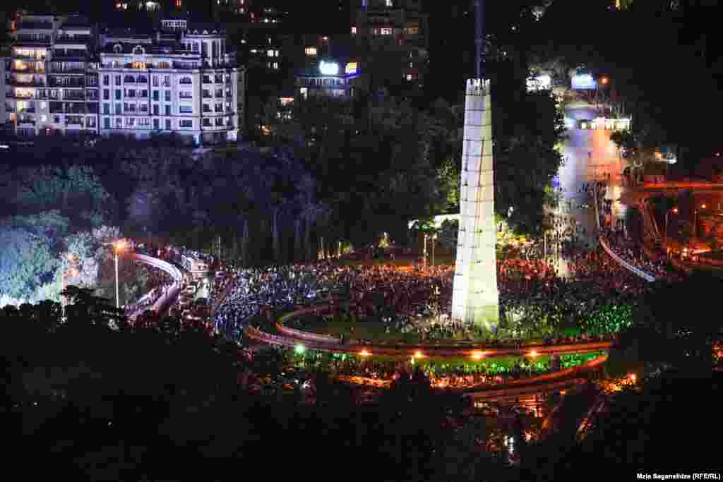 Peaceful protesters surround the monument on Heroes' Square. The May 1 demonstration -- one of the largest the country has ever seen -- took place after the bill advanced in a second-reading vote.&nbsp;