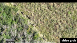 Російські військові евакуюють своїх поранених після невдалого штурму Надії