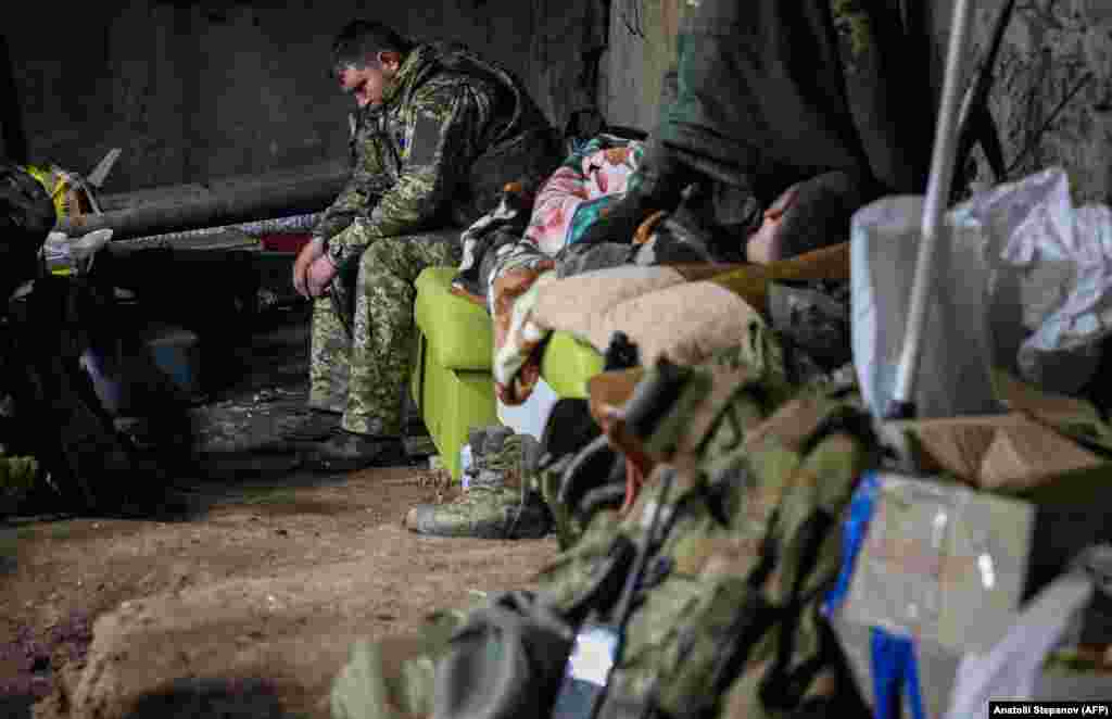 Ukrainian soldiers rest in a dimly lit and cramped basement as artillery rumbles above. "We're tired," said a deputy battalion commander whose call sign is Philosopher. "Little by little, (Russian forces) are nibbling away little pieces."&nbsp;
