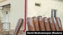 Coffins are placed outside a morgue in Stepanakert, September 24, 2023.