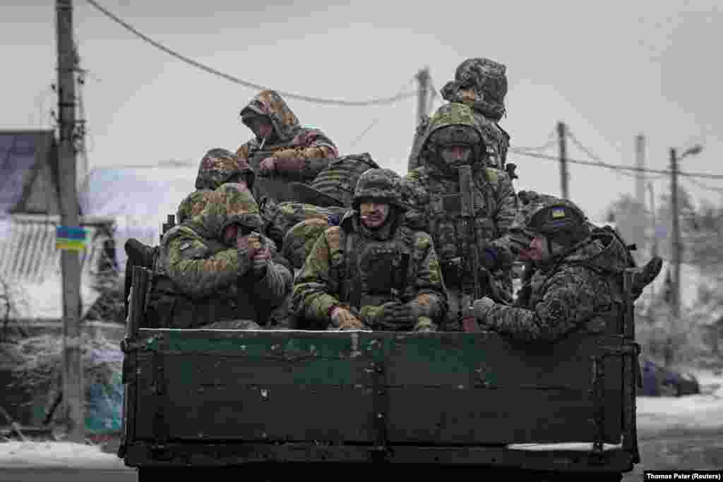 Ukrainian soldiers ride aboard a truck in the Donetsk region. "The volumes that we have today are not sufficient for us today, given our needs. So, we're redistributing it. We're replanning tasks that we had set for ourselves and making them smaller because we need to provide for them," General Tarnavskiy said, without providing details. &nbsp;