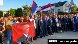 Bosnian Serb protesters carry portraits of Russian President Vladimir Putin as they rally in support of leader Milorad Dodik in East Sarajevo in September 2023. 