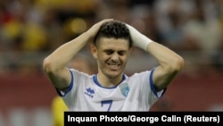 Futbollisti i Kombëtares së Kosovës në futboll, Milot Rashica, duke reaguar pas një rasti, gjatë ndeshjes kundër Rumanisë, në Bukuresht, më 12 shtator 2023.