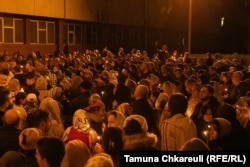 The congregation gathers in front of the church on Easter Eve.