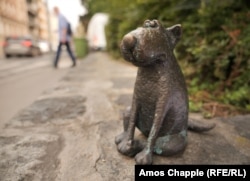 One of several dog statuettes on a small square in Pest