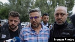 Ionuț Doldurea, unul dintre asociații Flagas, în momentul în care era dus la audieri