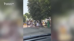 Flags, Tears, And Kneeling As Ukrainian Soldiers Return From Russian Captivity