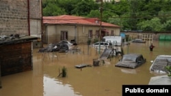 Armenia - Flooded homes and cars in the town of Alaverdi, May 26, 2024.