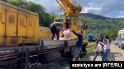 Armenia - People deliver food to a flooded community in Lori, May 28, 2024.
