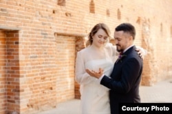 Almaz Gatin (right) and Lilia Chanysheva on their wedding day.