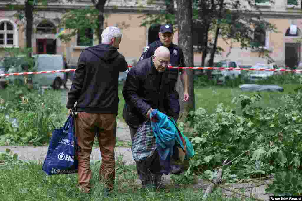 A resident removes some of his personal belongings.