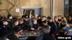 Ucha Abashidze, a military expert, blogger, and activist, was arrested at his home in Tbilisi, accused of illegally purchasing and storing weapons.