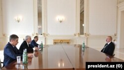 Президент Азербайджана Ильхам Алиев принимает спецпосланника главы МИД РФ по вопросам нормализации отношений между Арменией и Азербайджаном Игоря Ховаева, Баку, 14 февраля 2023 г.