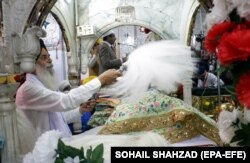 A Sikh pilgrim attends a religious ceremony at the Gurdwara Panja Sahib, one of the sacred sites, in Hassan Abdal, a town in the eastern Pakistani province of Punjab.