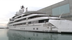 Crew Of Seized 'Putin's Yacht' Scrambles To Confront RFE/RL Reporters