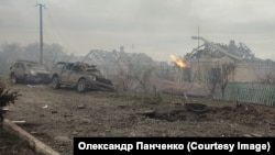 The aftermath of a deadly Russian missile strike on the Ukrainian village of Zarichne on November 3. 