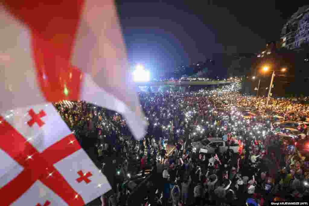 Peaceful protesters descend upon Heroes' Square. The bill would require organizations receiving more than 20 percent of their funding from abroad to register as "agents of foreign influence." Opponents warn that implementing the law could jeopardize the country's move toward European Union membership.