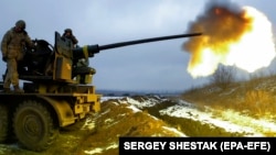 Ukrainian soldiers fire from an antiaircraft gun at Russian positions near Bakhmut in the Donetsk region. (file photo)