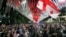 Demonstrators take to the streets of Tbilisi on May 28 to protest against the "foreign agents" law, which critics have compared to similar legislation in Russia widely used to suppress dissent and weaken democratic institutions.