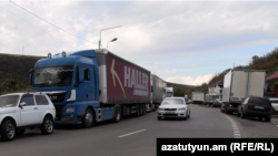 Armenia - Heavy trucks are lined up on a highway outside the Bagratashen border crossing with Georgia, October 21, 2025.
