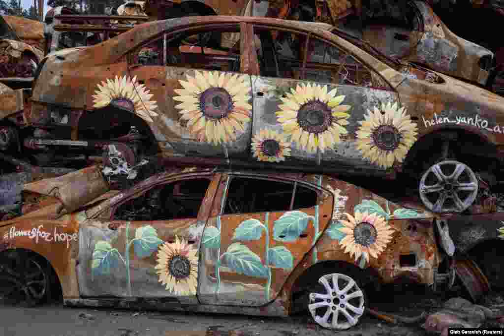 The installation is located on the main road leading into Irpin, where authorities say 200-300 civilians were killed during the invasion that began on February 24. The shattered city was taken back by Ukrainian forces in late March. City authorities approved the work and assured the artists no one had died in the vehicles.