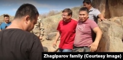 Amateur archaeologist Yerlan Zhagiparov (pink T-shirt) was detained by security forces in Almaty on January 6, 2022. Days later, his family collected his battered body.