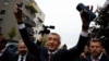 The leader of the ANO party, Andrej Babis, celebrates as he reacts to the preliminary results of parliamentary elections, in Prague on October 4. 
