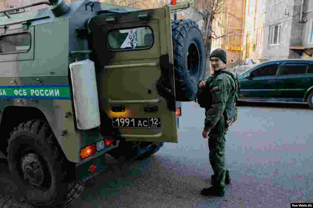 A Russian peacekeeping soldier stands next to a vehicle with a "Z" marking associated with support for the invasion of Ukraine. Photographer Tom Videlo says many Karabakh locals see the ongoing inaction of Russian peacekeepers to clear the Lachin road as a calculated political move to exert pressure on Yerevan for Russia's own geopolitical goals. &nbsp;