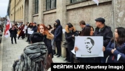 People take part in a rally in support of former Georgian President Mikheil Saakashvili in Munich on January 4. 