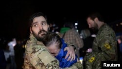 Орус туткунунан бошотулган украиналыктар. 