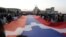 Nagorno-Karabakh - Demonstrators carry a huge Karabakh flag in Stepanakert, September 2, 2022.