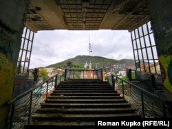 A view of the TV tower and Giant Wheel on Tbilisi's Mount Mtatsminda from the derelict Soviet-era cable car station on Rustaveli Avenue.