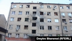 یکی از بلاک های رهایشی در منطقه خرسون اوکراین که هدف حملات راکتی قوای روسیه قرار گرفته است December 28, 2022