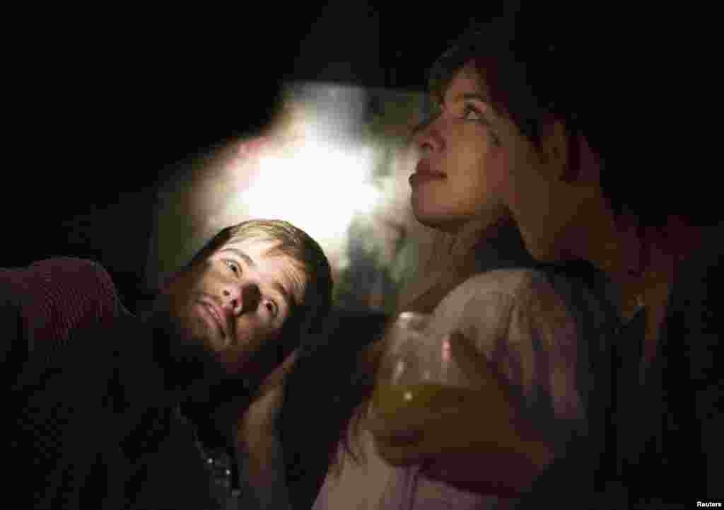 Pyotr Verzilov (left) and his wife, Nadezhda Tolokonnikova, attend the wedding anniversary of a fellow activist at an artist's studio in Moscow in January 2008.