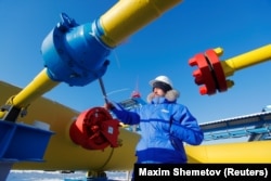 An employee checks a gas valve at the Atamanskaya compressor station, part of Gazprom's Power of Siberia gas pipeline, outside the Far Eastern town of Svobodny in the Amur region of Russia.