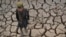 A child walks over parched land in the Bala Murghab district of Badghis Province on October 15. 